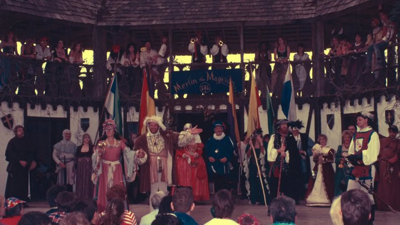 a group of people performing on stage in front of a crowd
