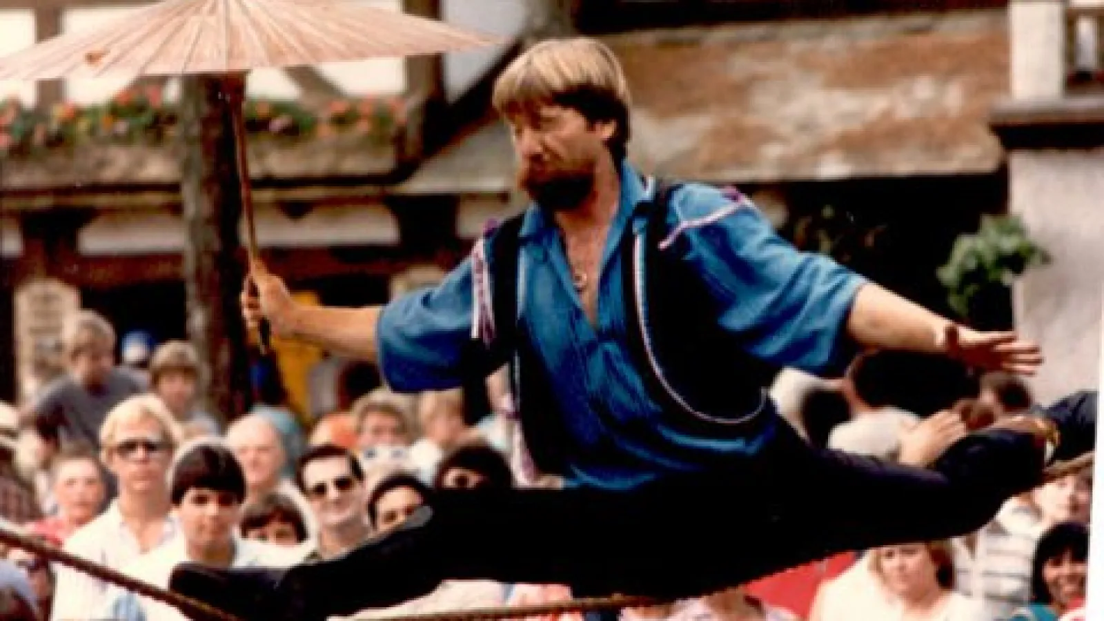 a group of people jumping in front of a crowd