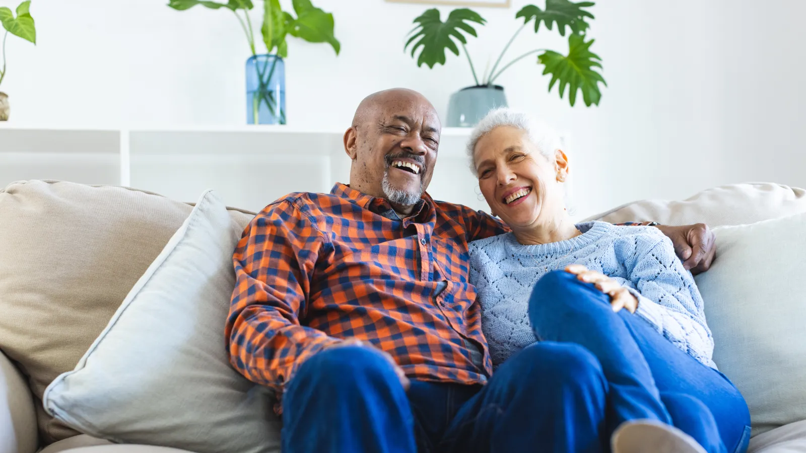 a man and woman sitting on a couch