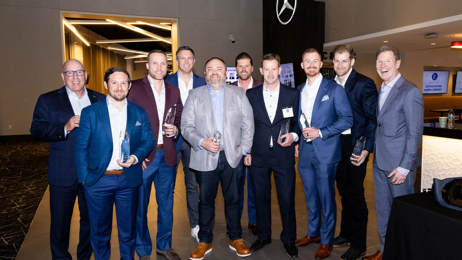 a group of men posing for a photo