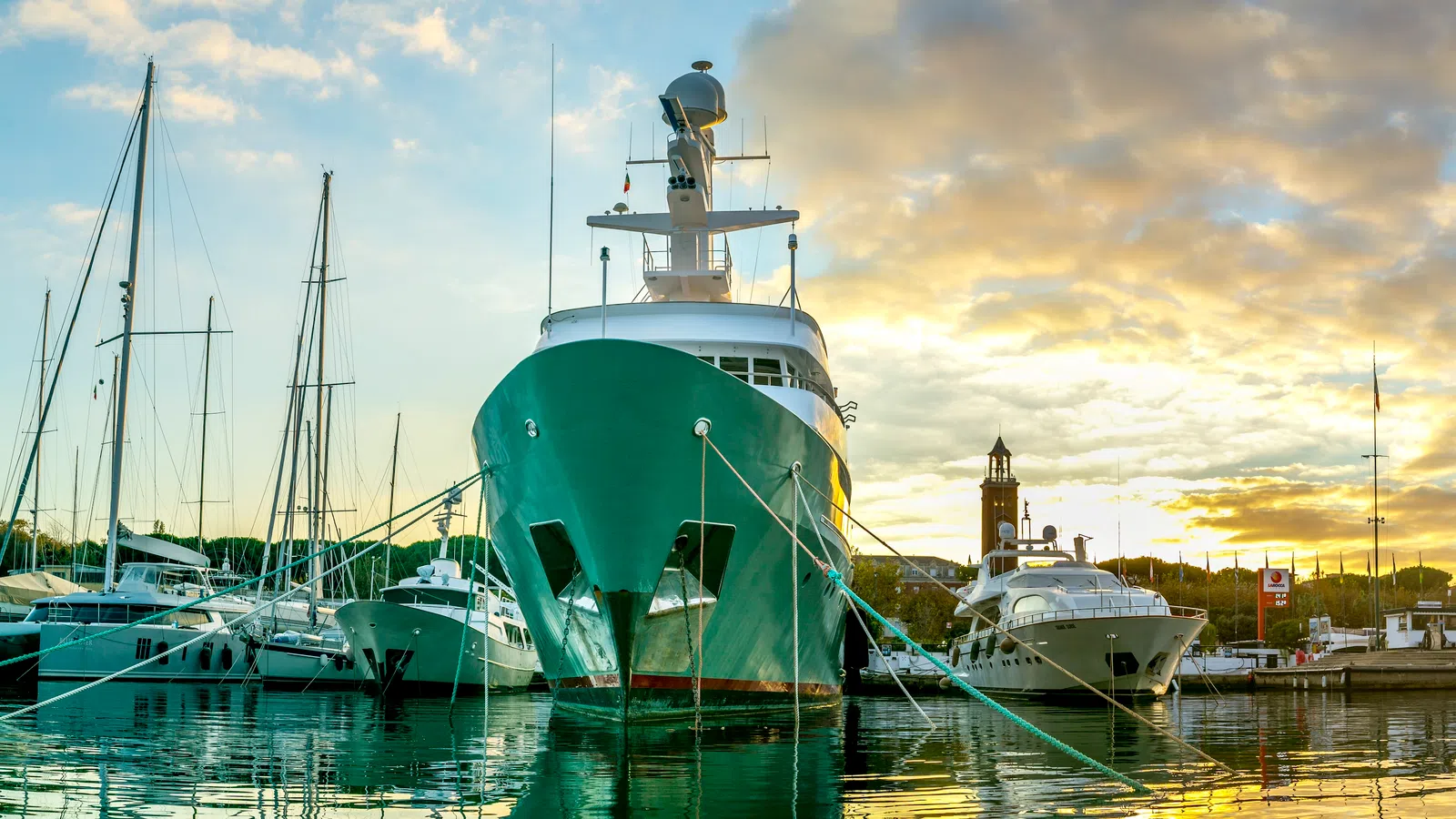 a group of boats sit in a harbor