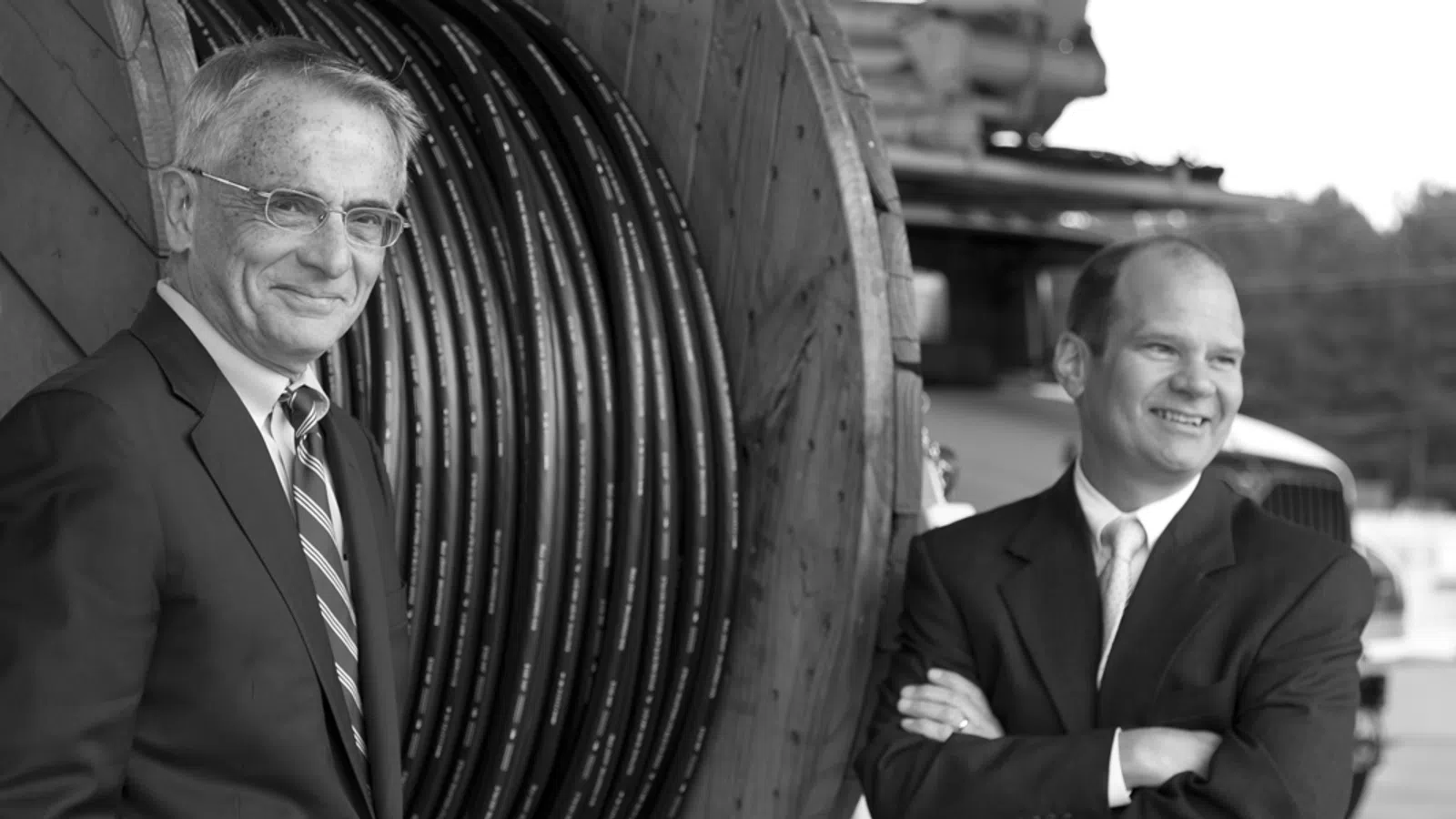 two men wearing suits