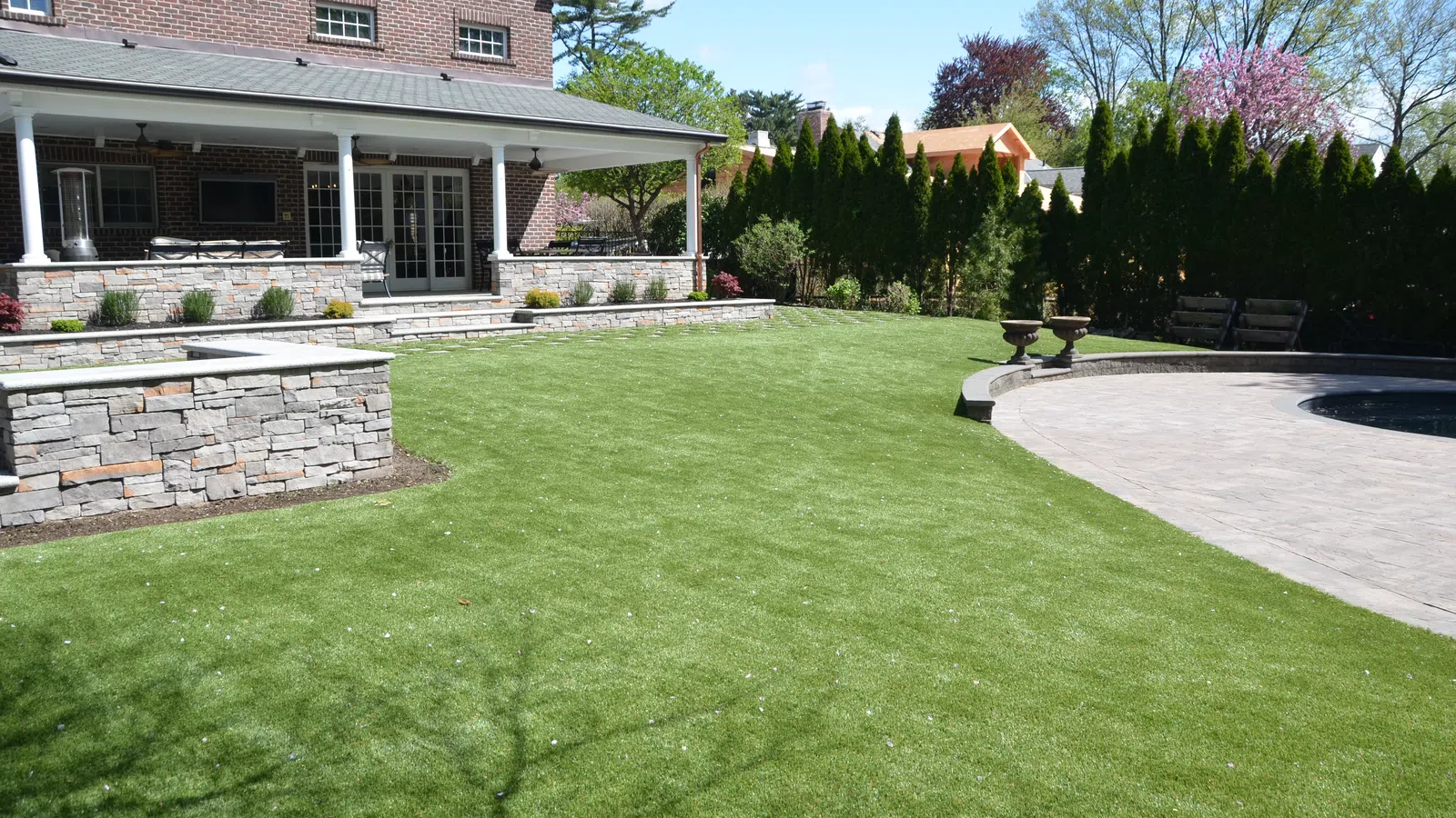 a large green lawn in front of a house