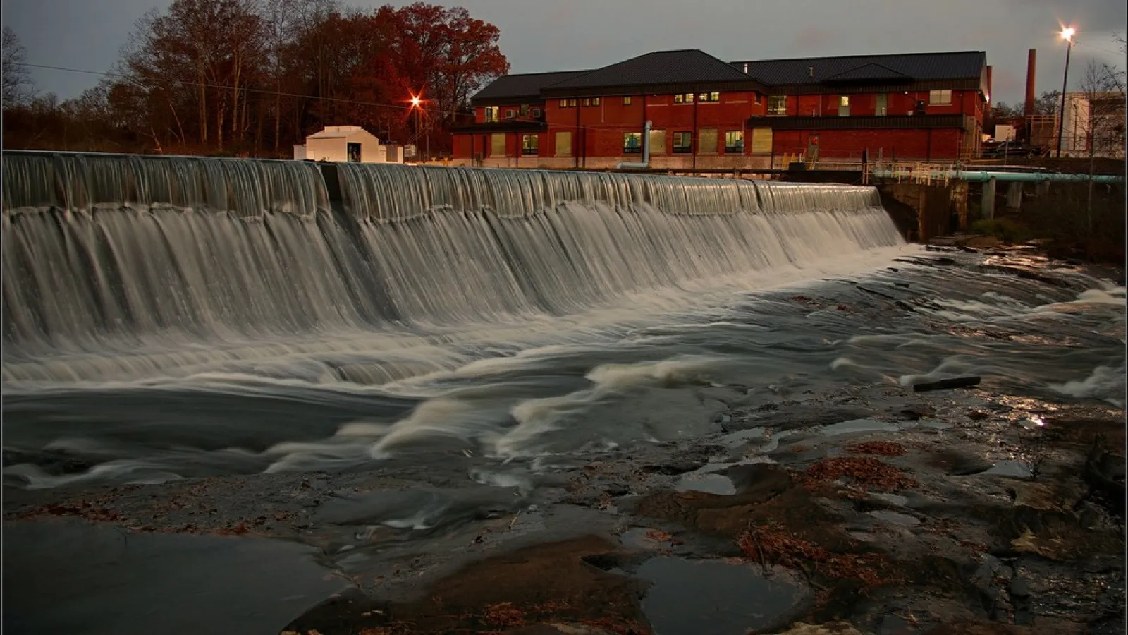 red brick building beside river