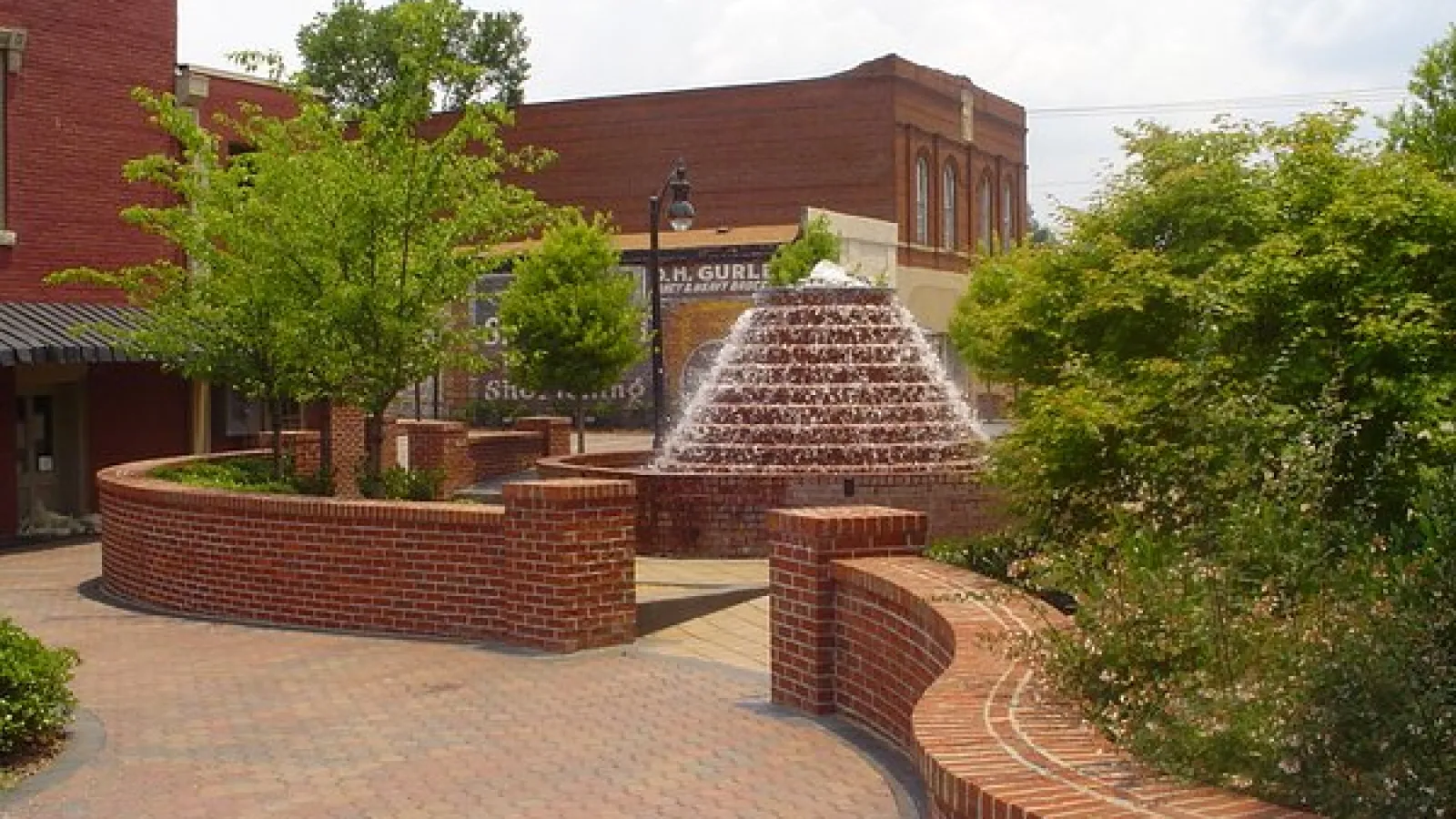 downtown area with waterfall brick fountain