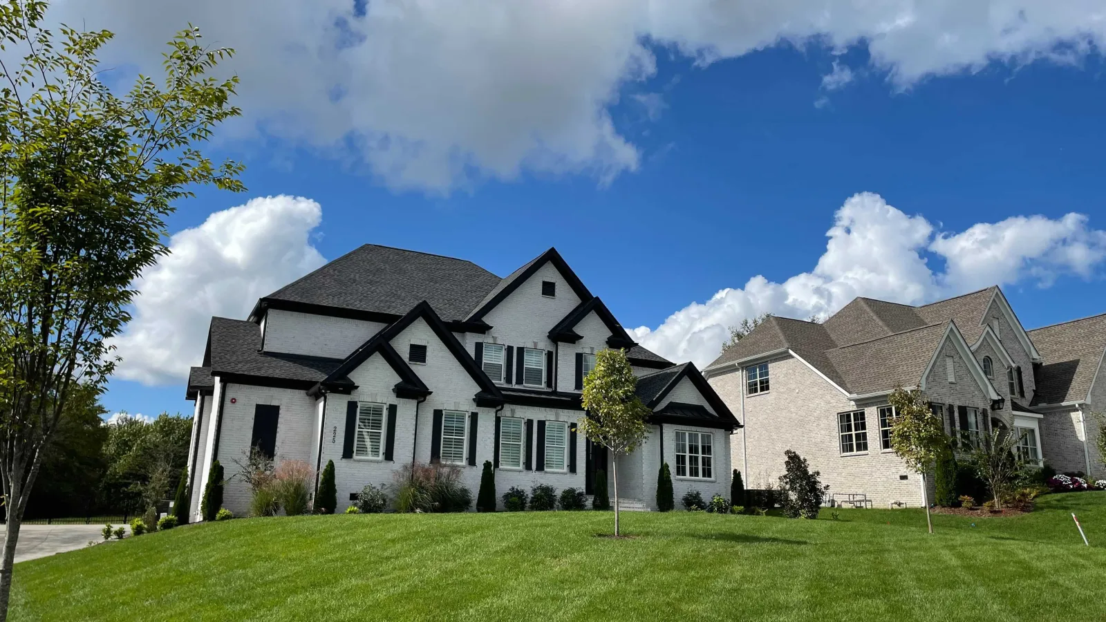 a large house with a lawn in front of it