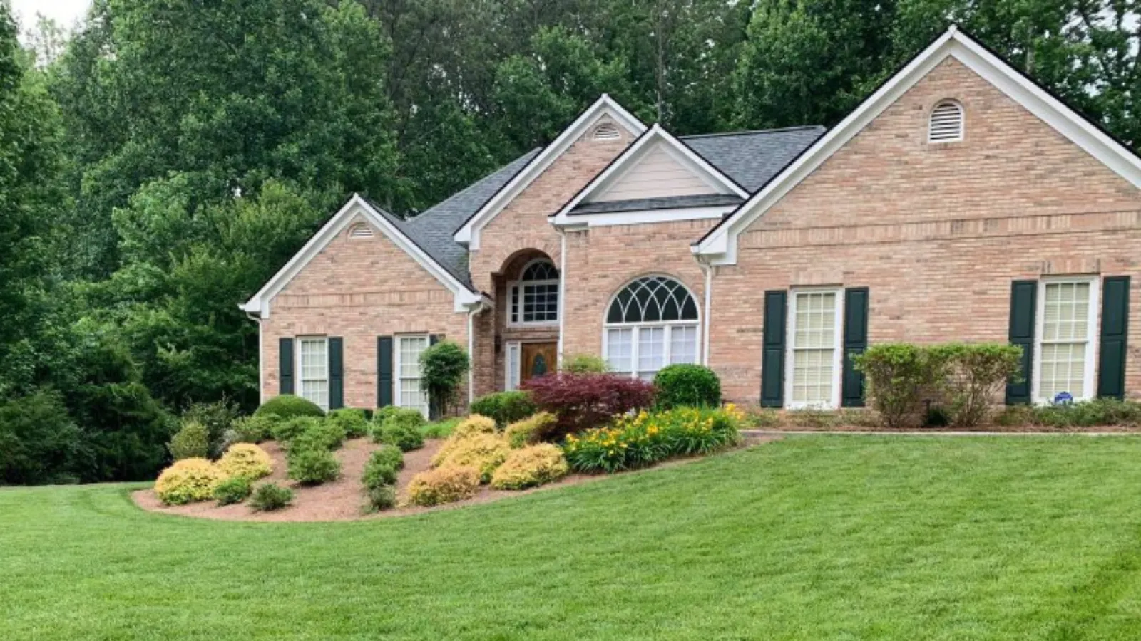 a large house with a lawn