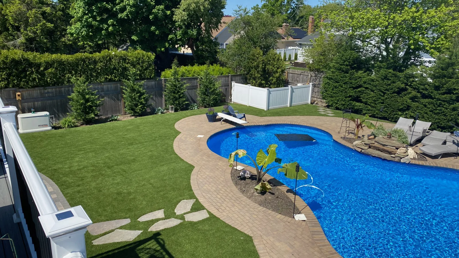 a backyard with a pool and a slide