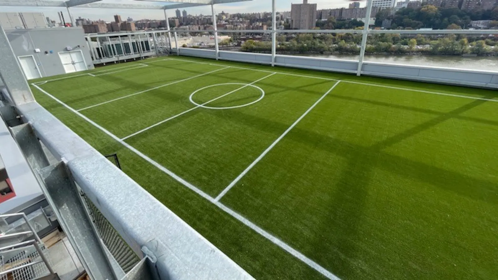 a sports field with a fence