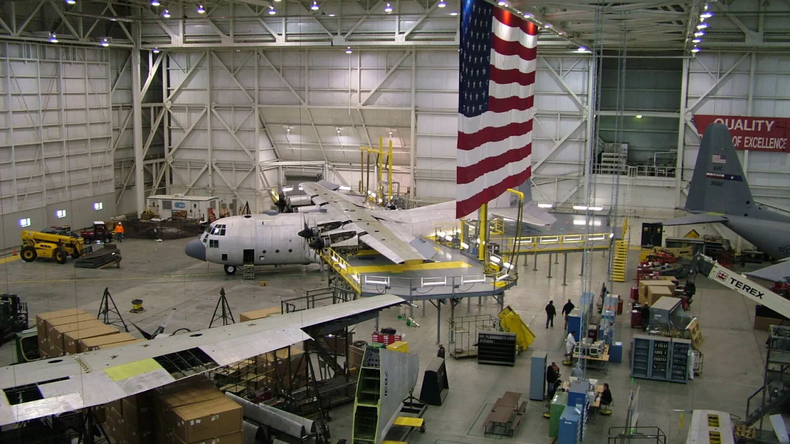 a large airplane hangar with several planes