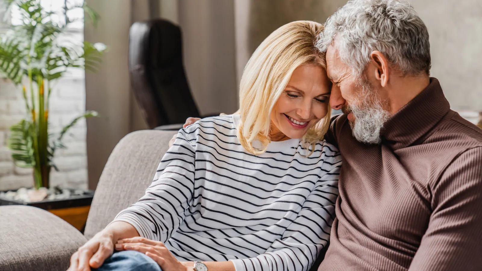 a man and a woman sitting on a couch