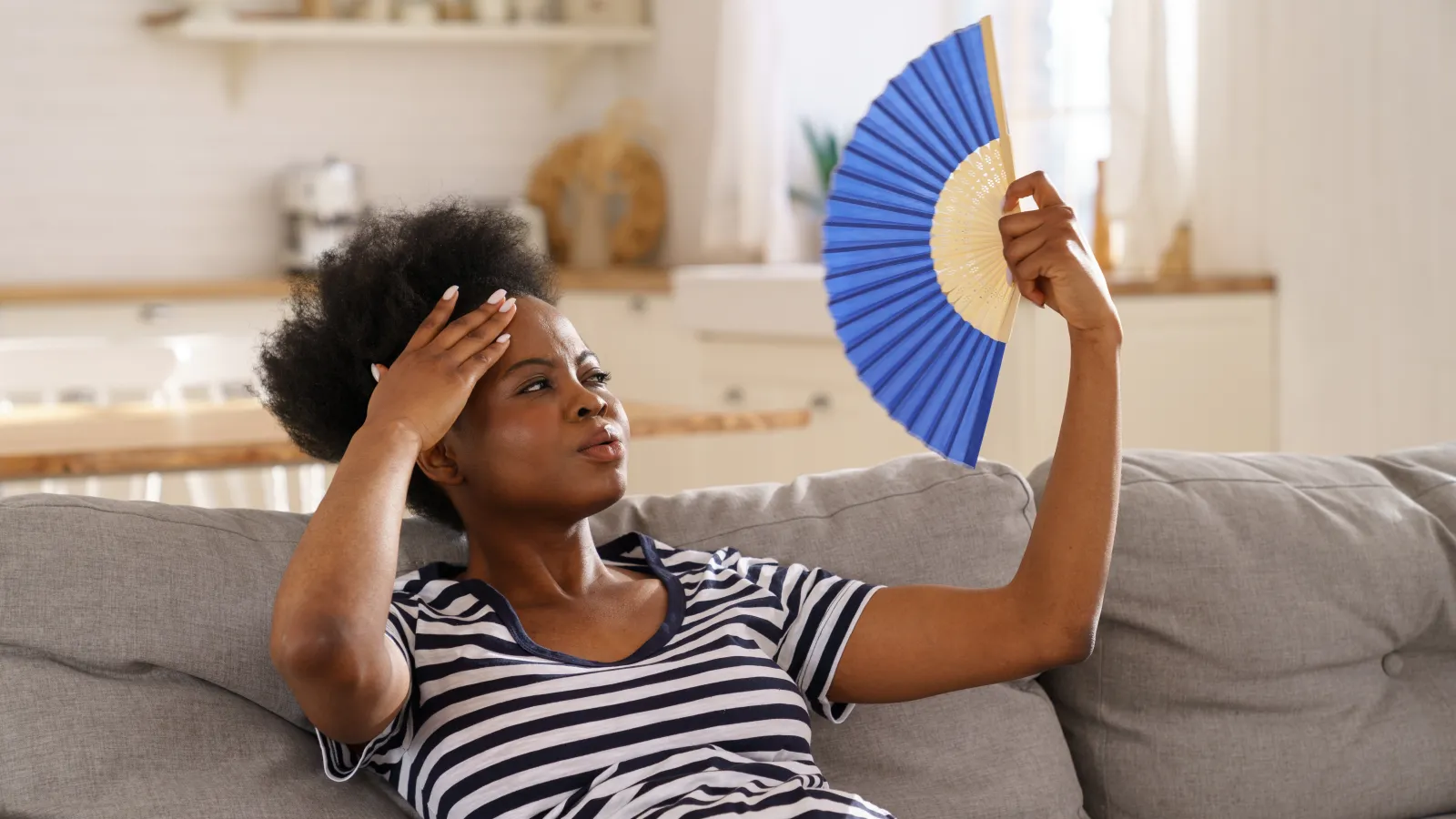 a person holding a fan