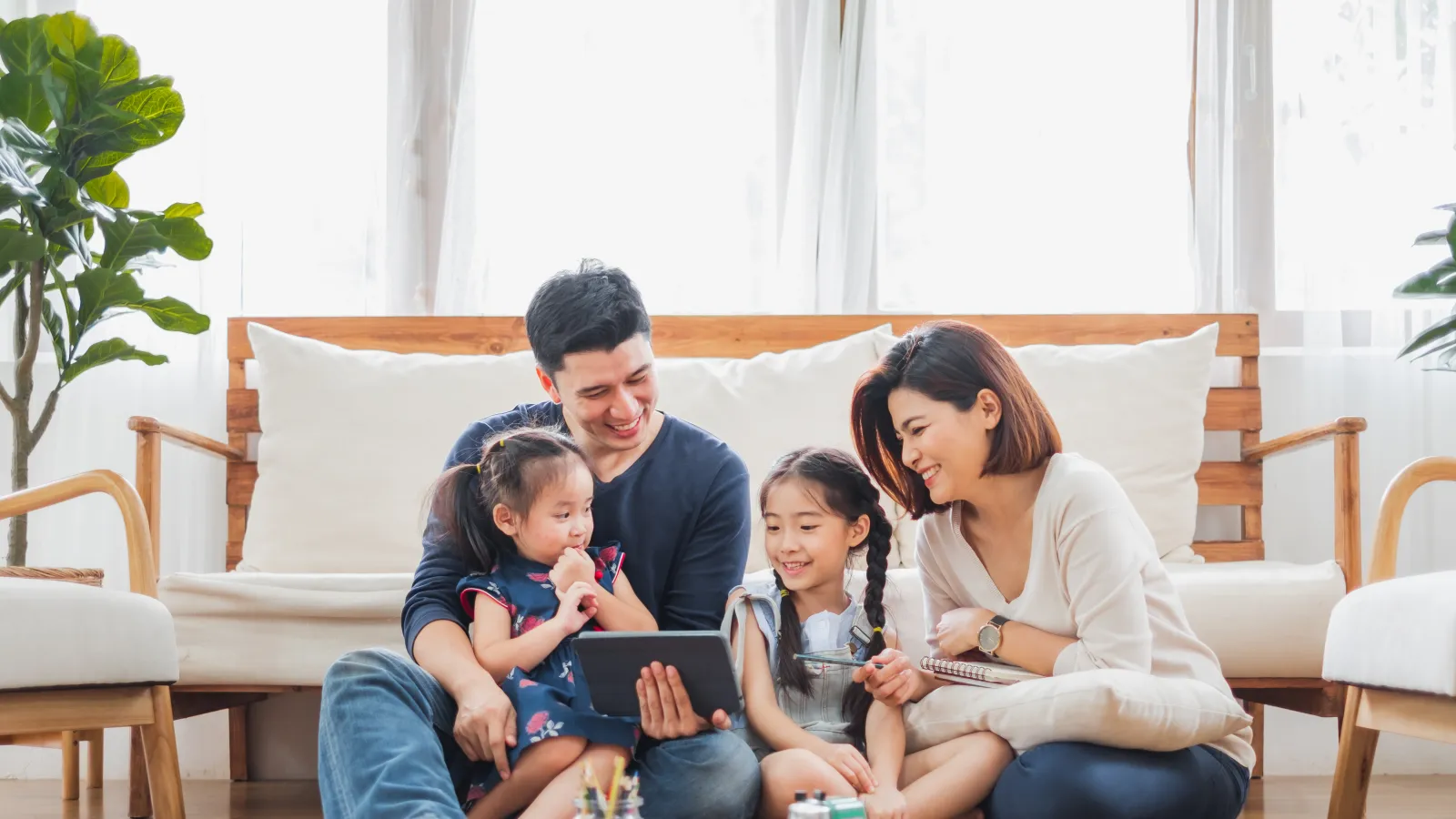 a family sitting on the floor