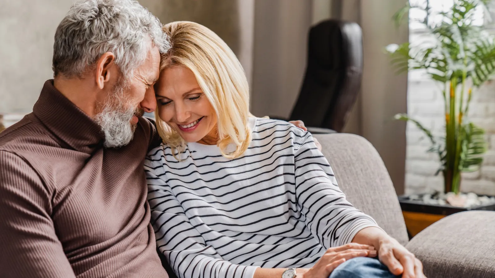 a man and a woman sitting on a couch