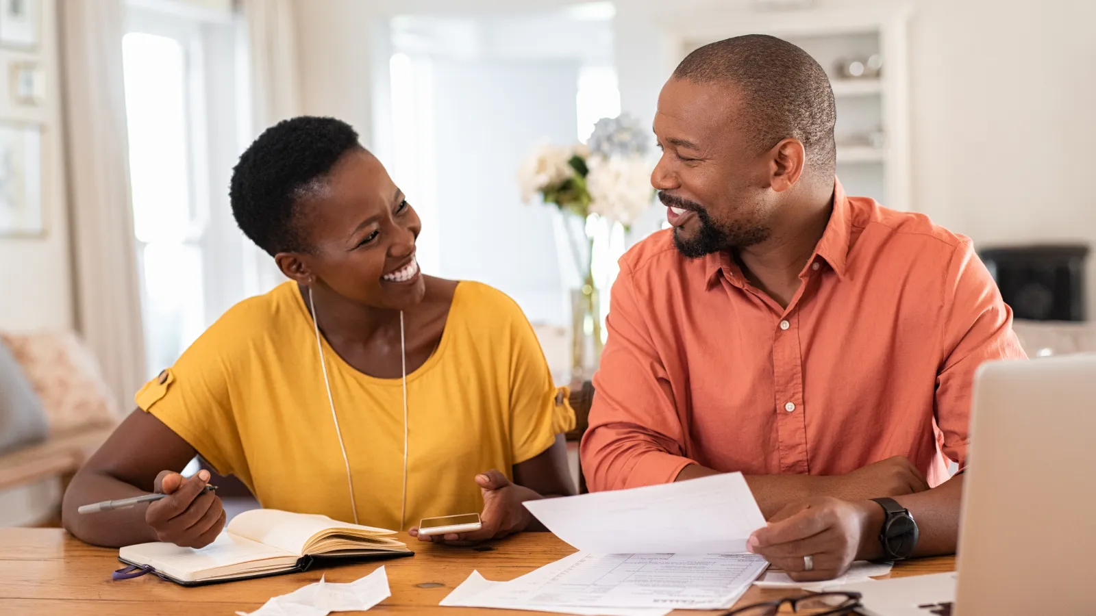 a man and a woman looking at a paper