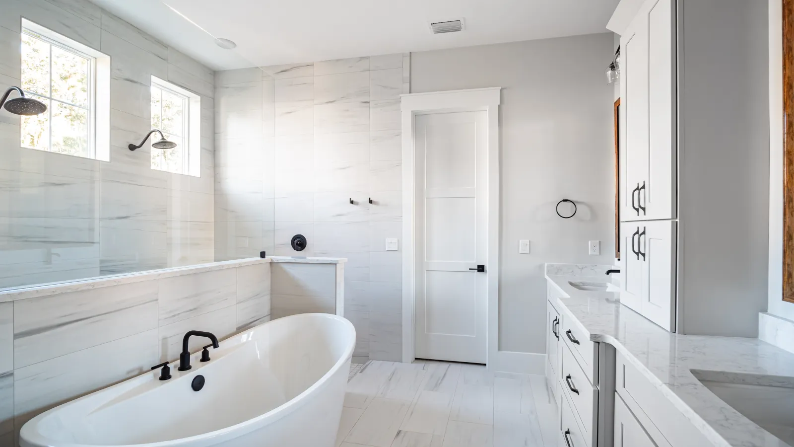 a bathroom with a tub and sink
