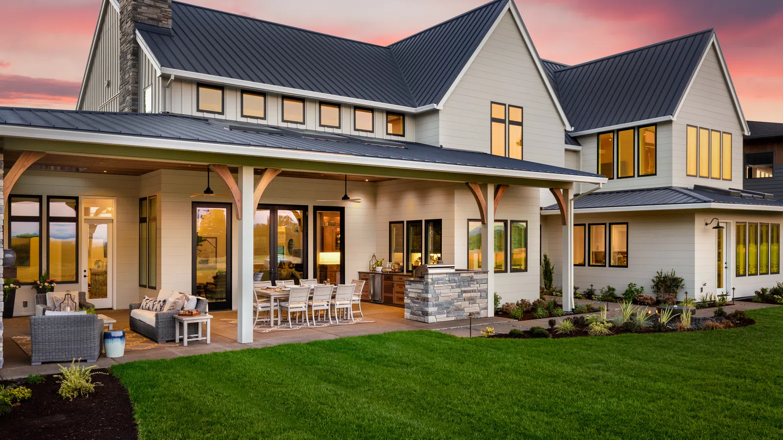 a house with a lawn and chairs