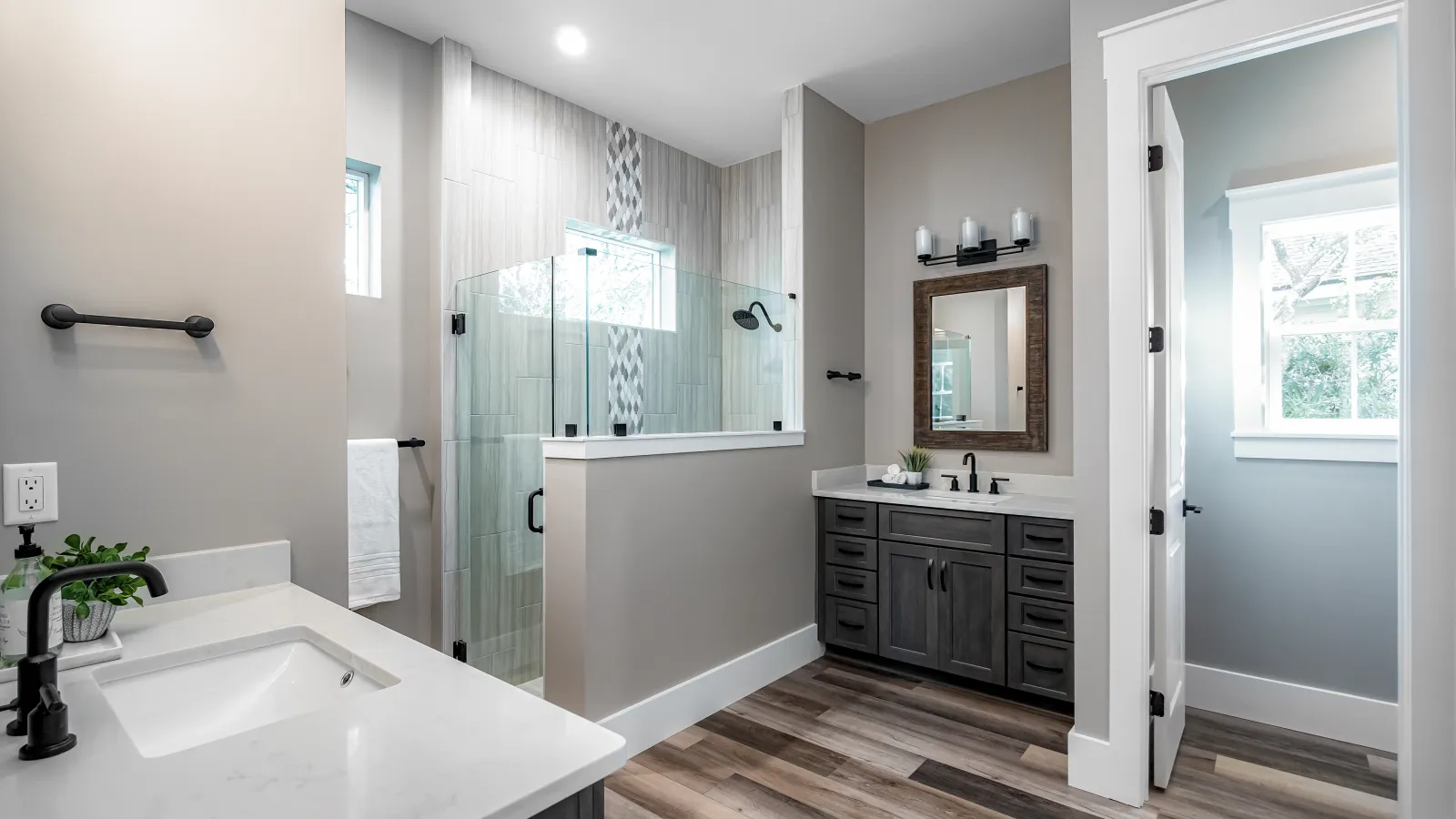 a bathroom with a tub sink and a shower
