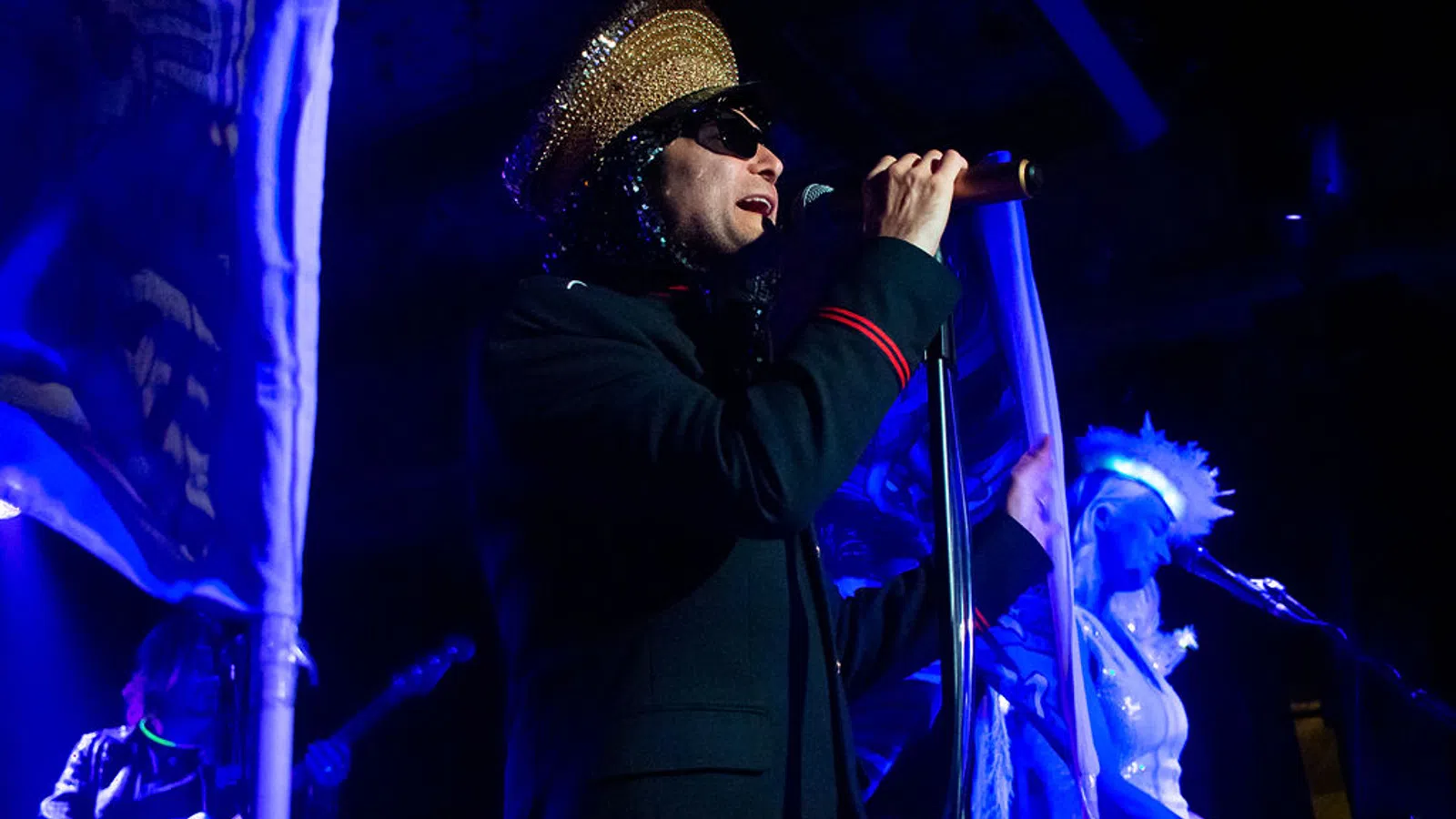 a man singing into a microphone