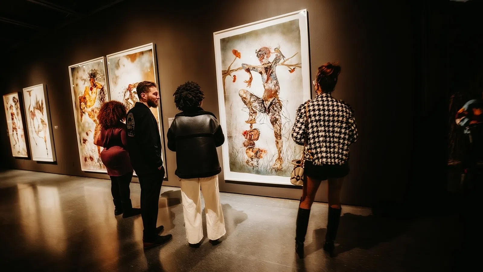 a group of people looking at art