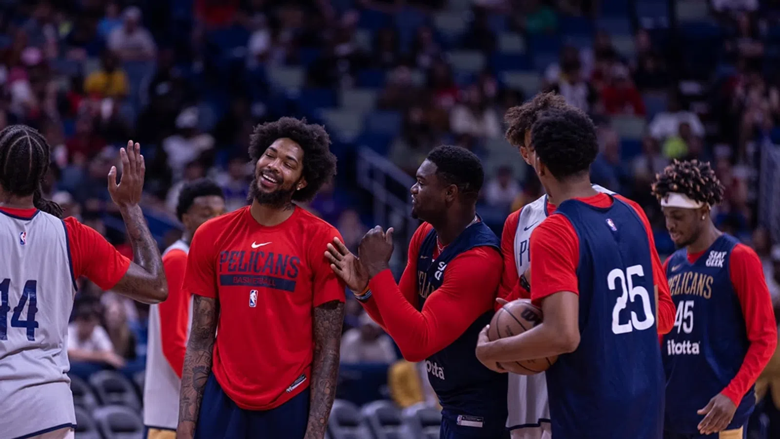 a group of men in sports uniforms