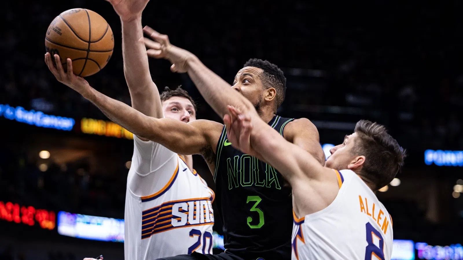 a basketball player dribbling the ball