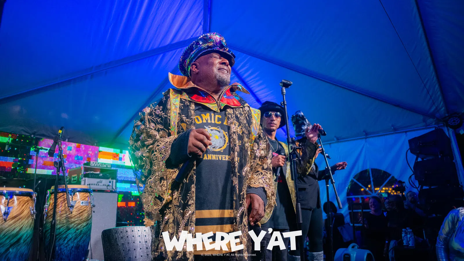 a man wearing a camouflage uniform and holding a microphone