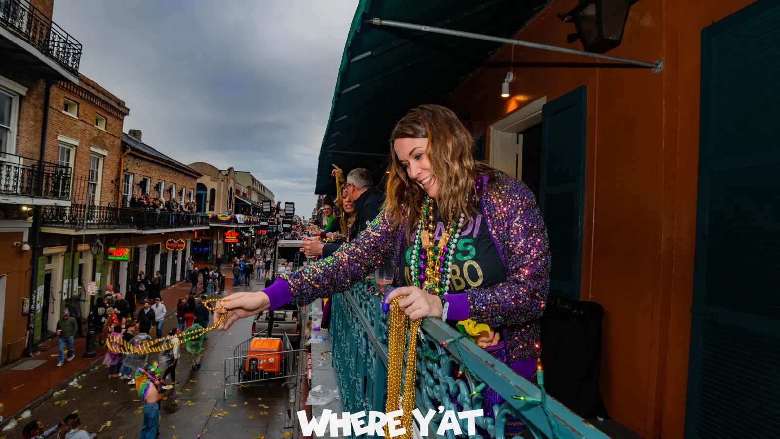 a person holding a large colorful snake