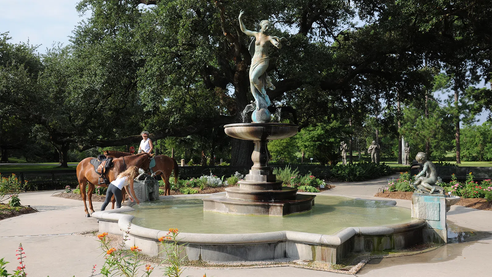 a person riding a horse in a fountain