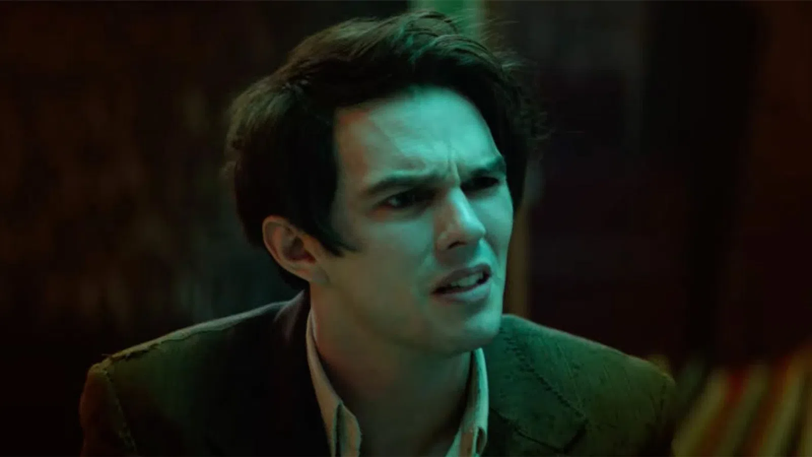 Nicholas Hoult looking to the side