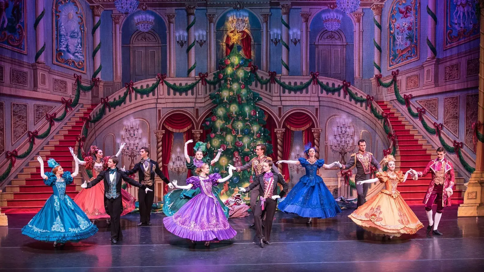 a group of people dancing on a stage