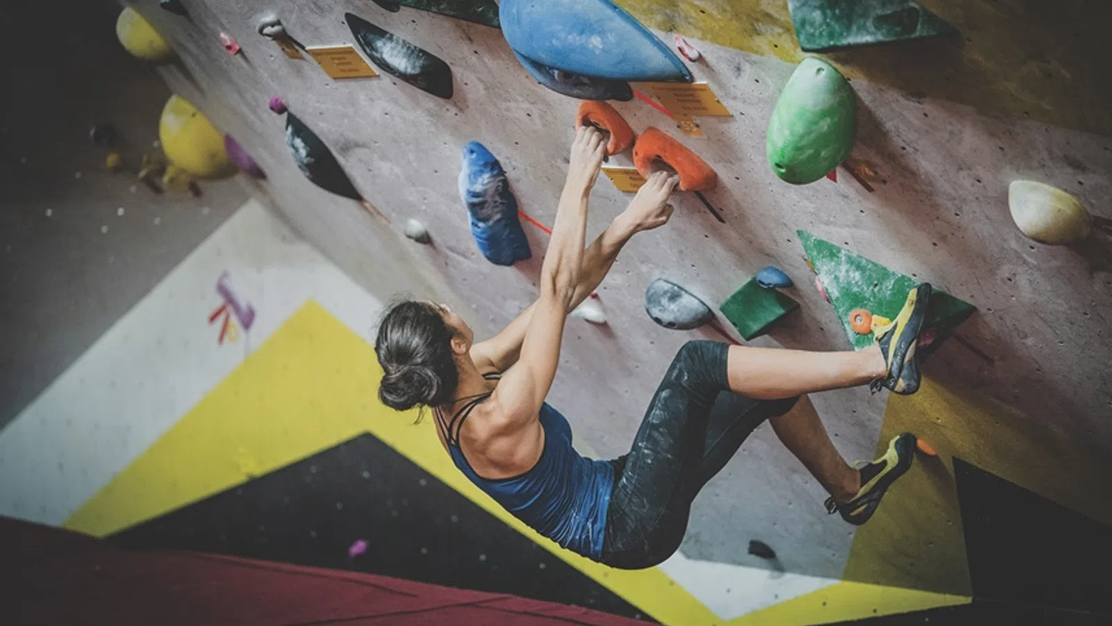 a boy on a climbing wall