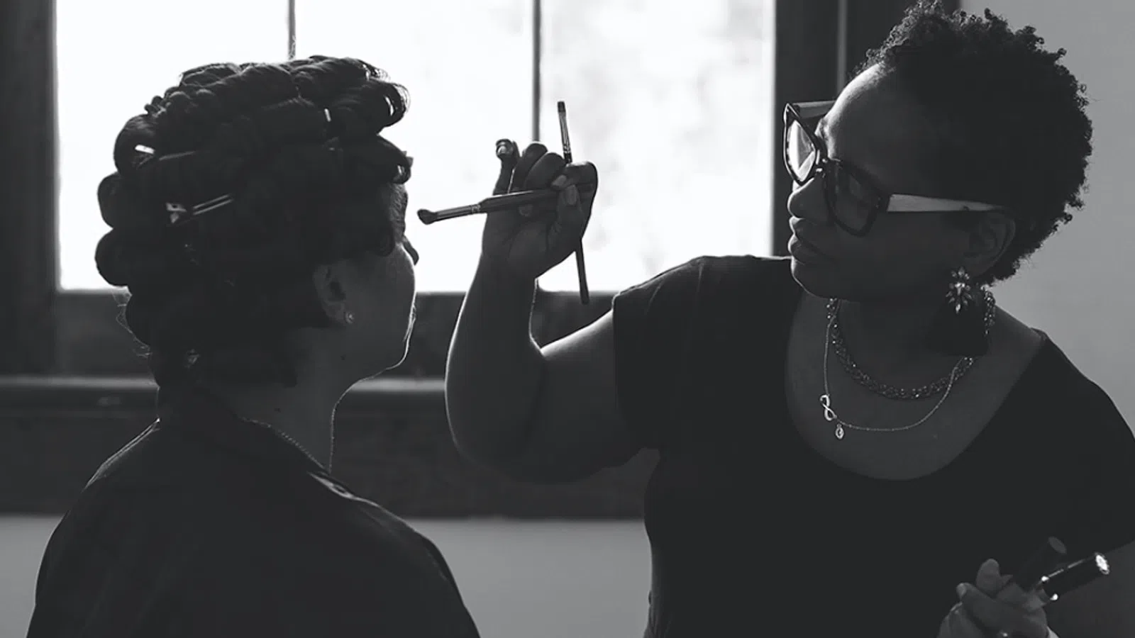 a woman with a mask on her face and a man with a gun