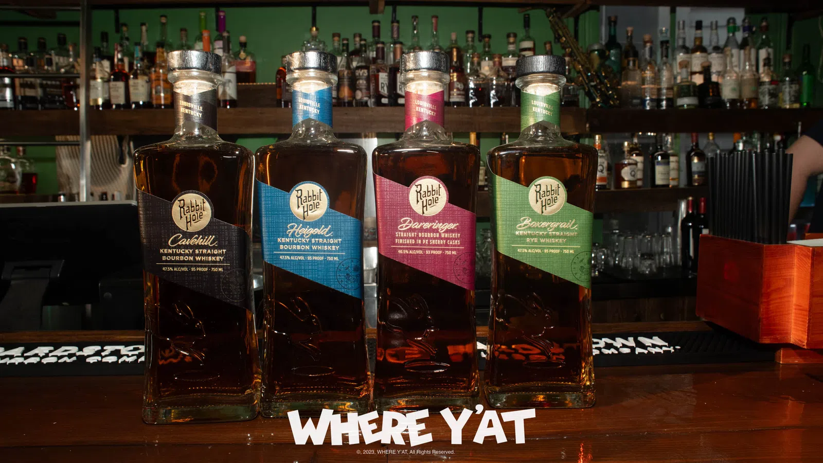 a group of bottles on a bar