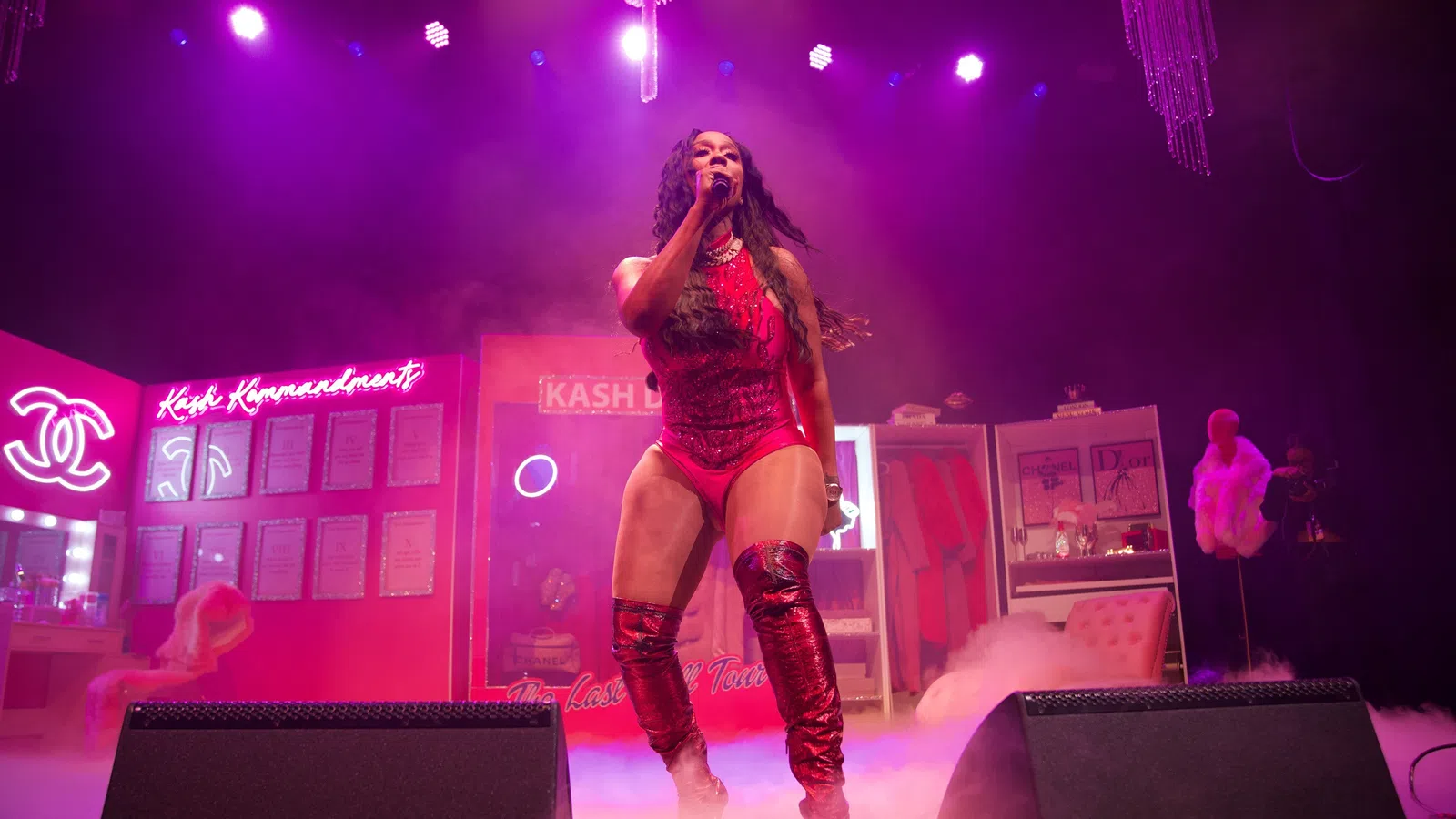 a woman singing on a stage