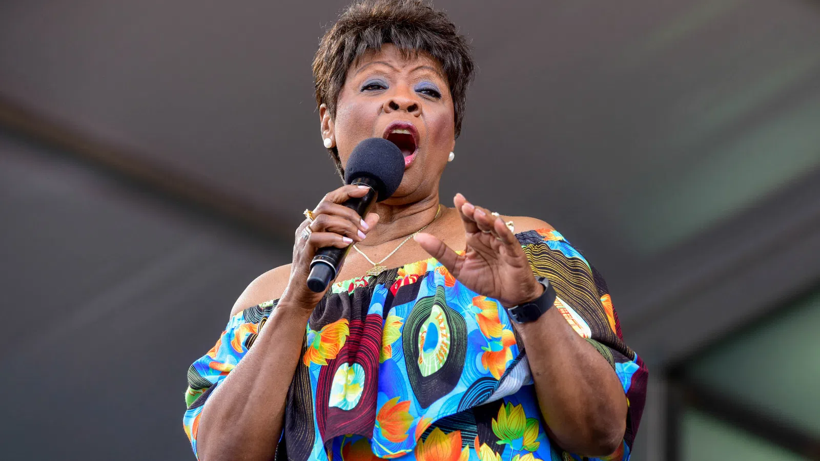 a person singing into a microphone
