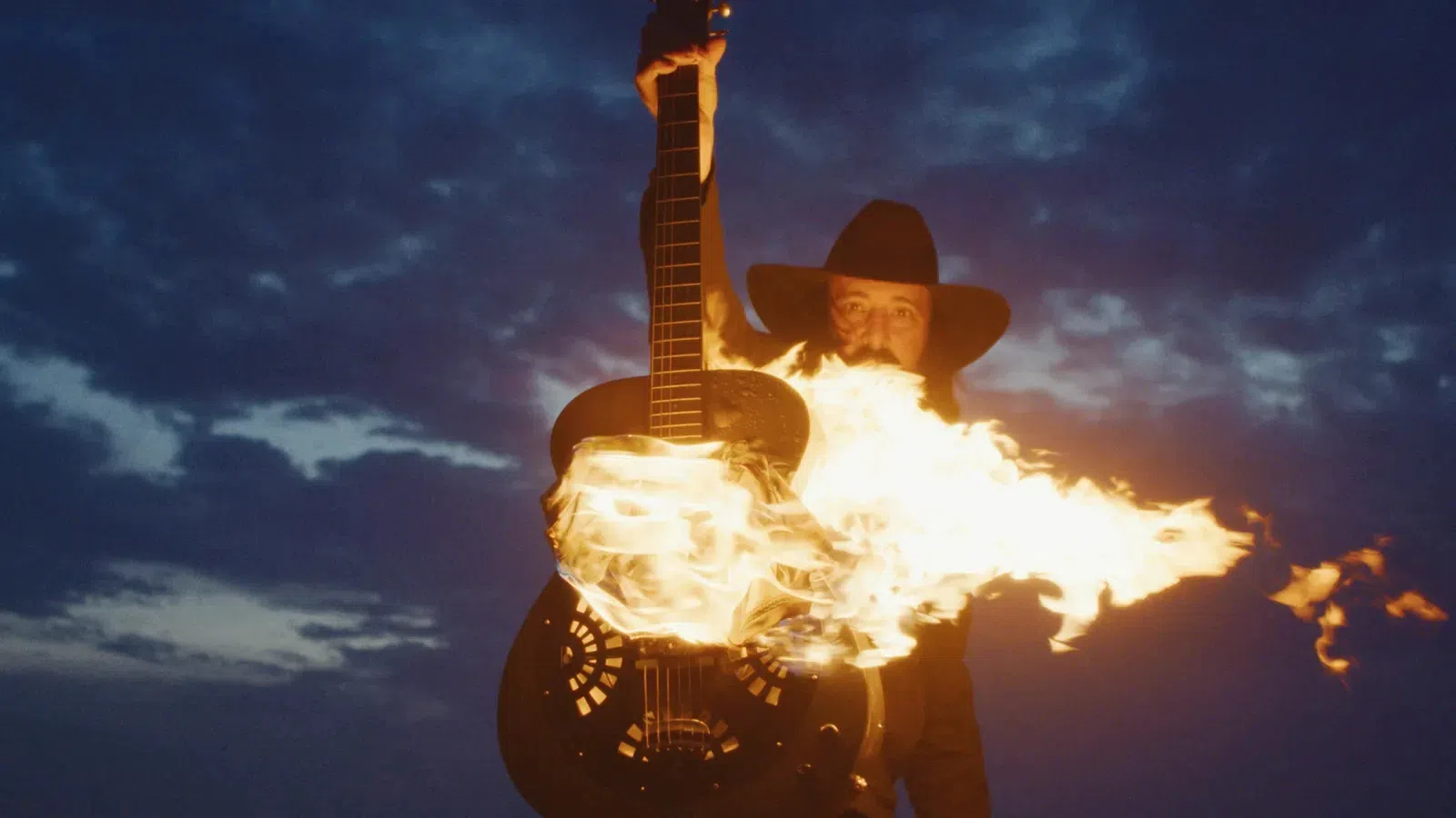 a man holding a guitar