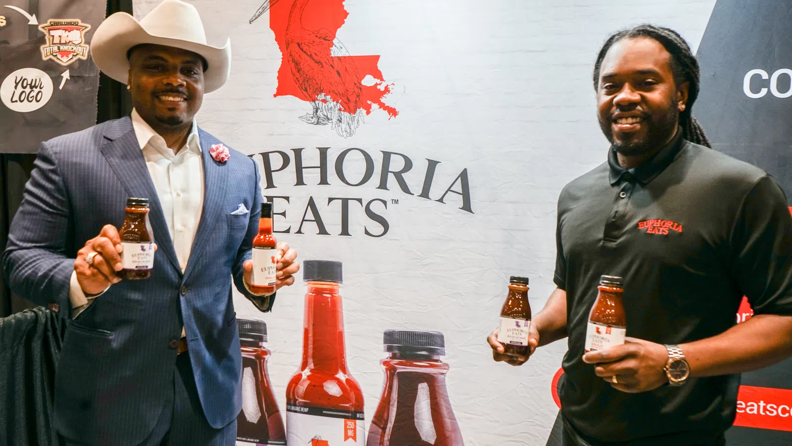 a couple of men holding bottles of alcohol