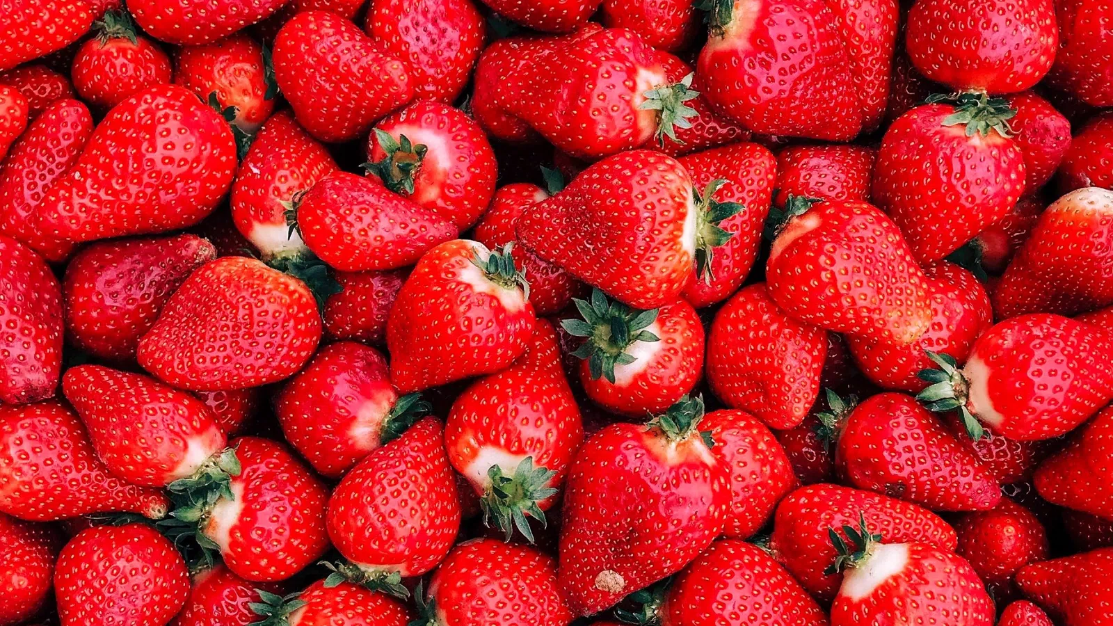 a pile of strawberries