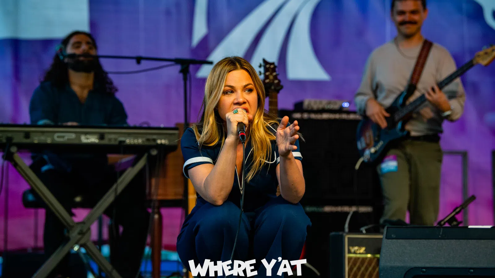 a person singing on stage