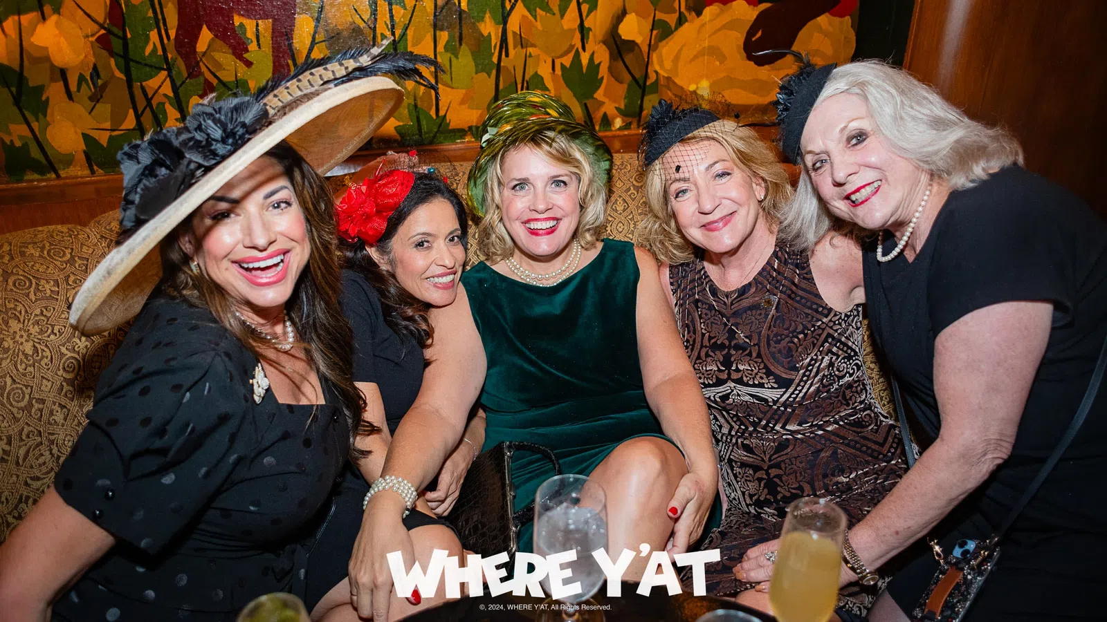 a group of women posing for a photo