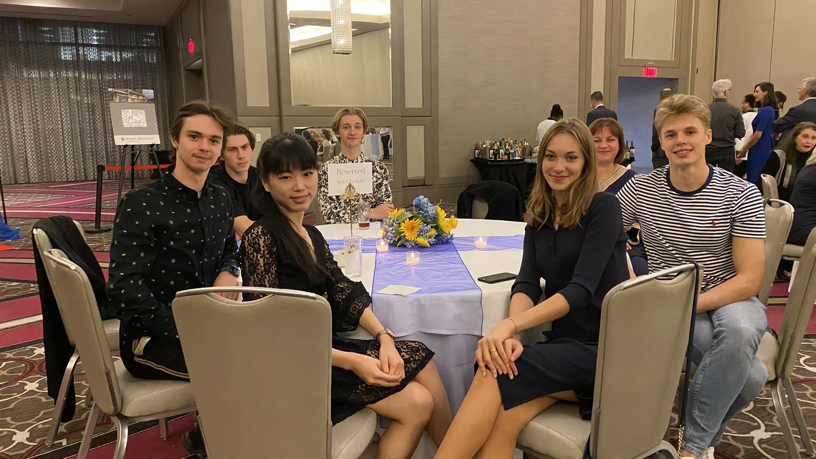 a group of people sitting around a table