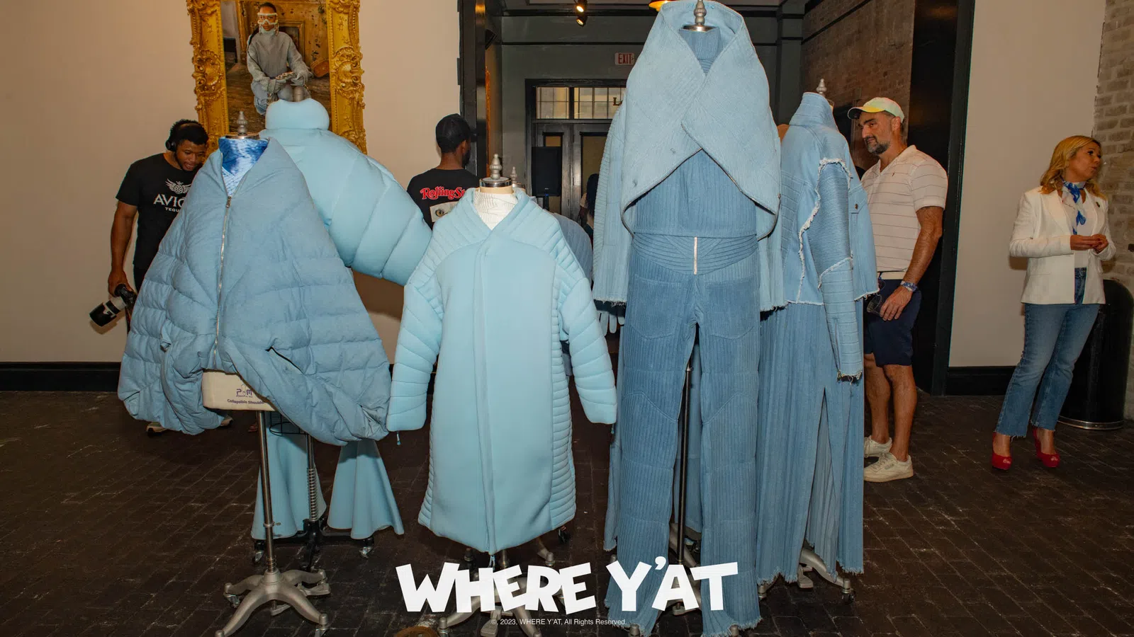 a group of people in blue dresses