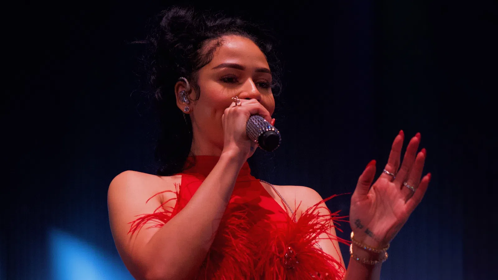 a woman singing into a microphone