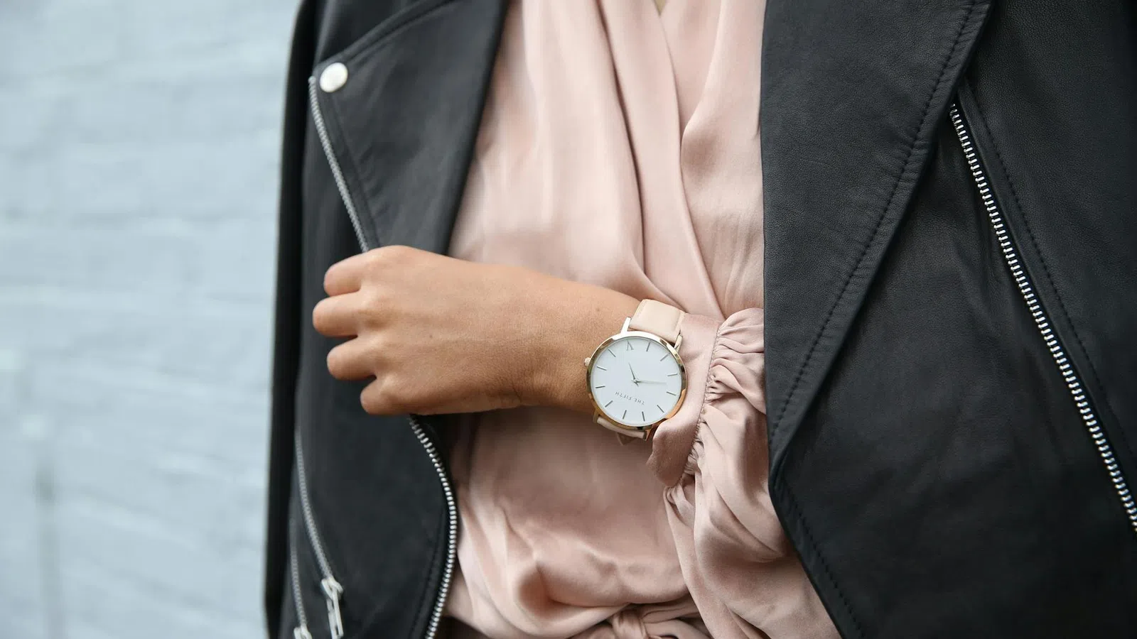 a person wearing a suit and a watch