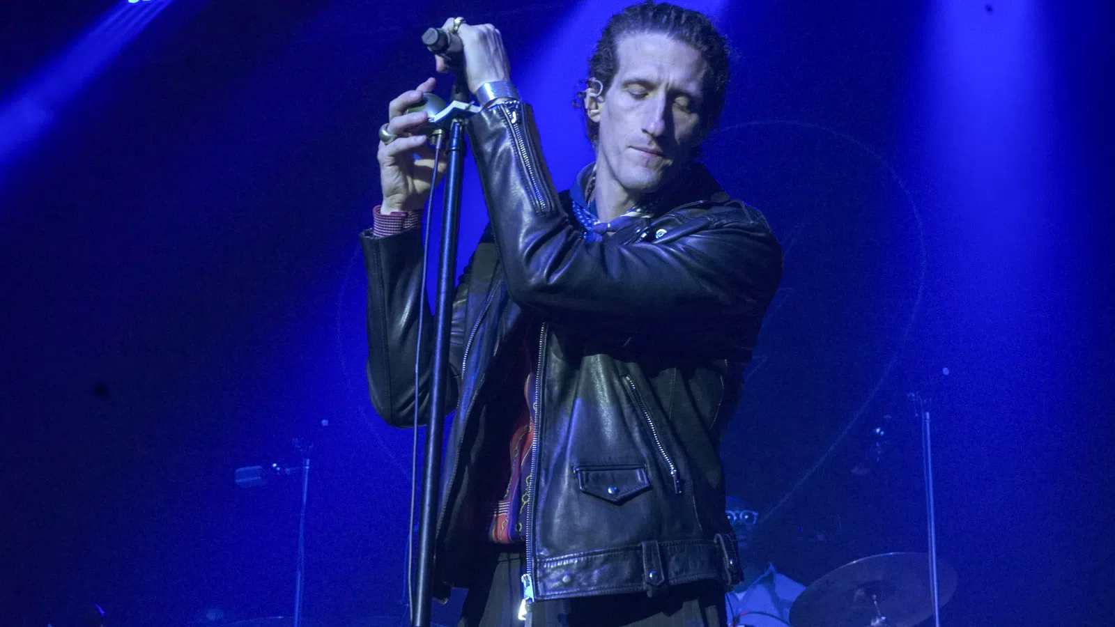 Joe Volpe holding a microphone