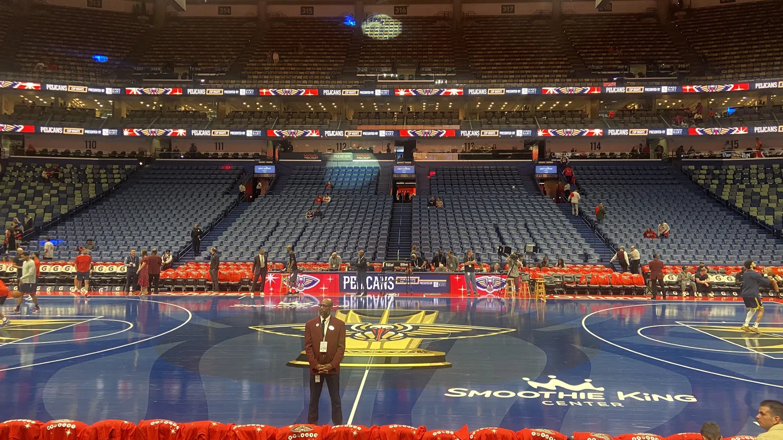 a person standing in a large empty arena