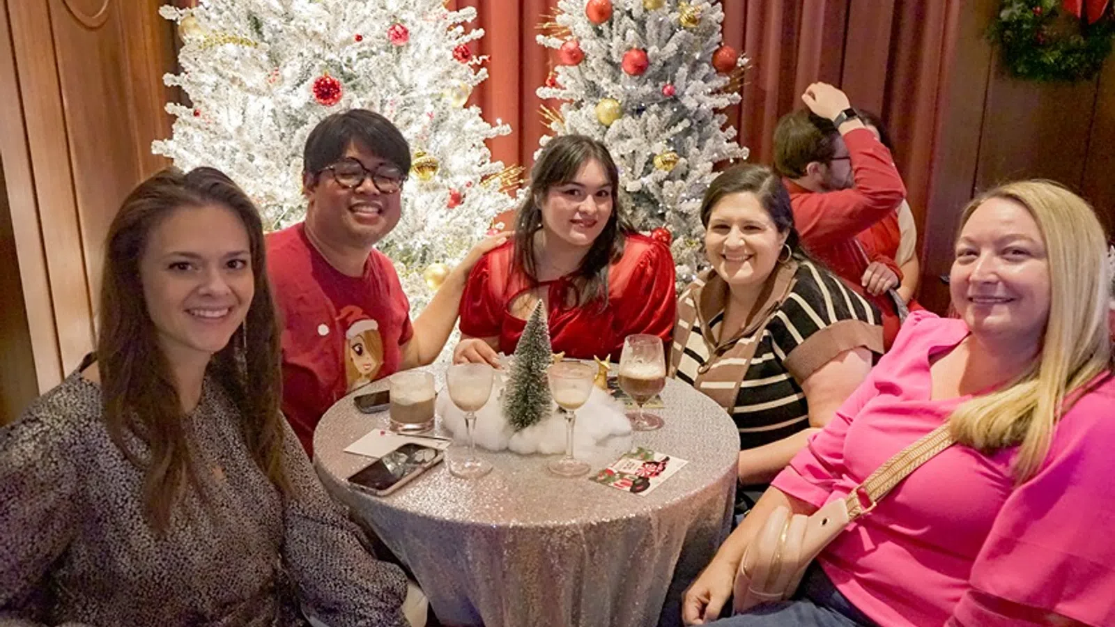 Pauleen Luna et al. sitting around a table with food and drinks