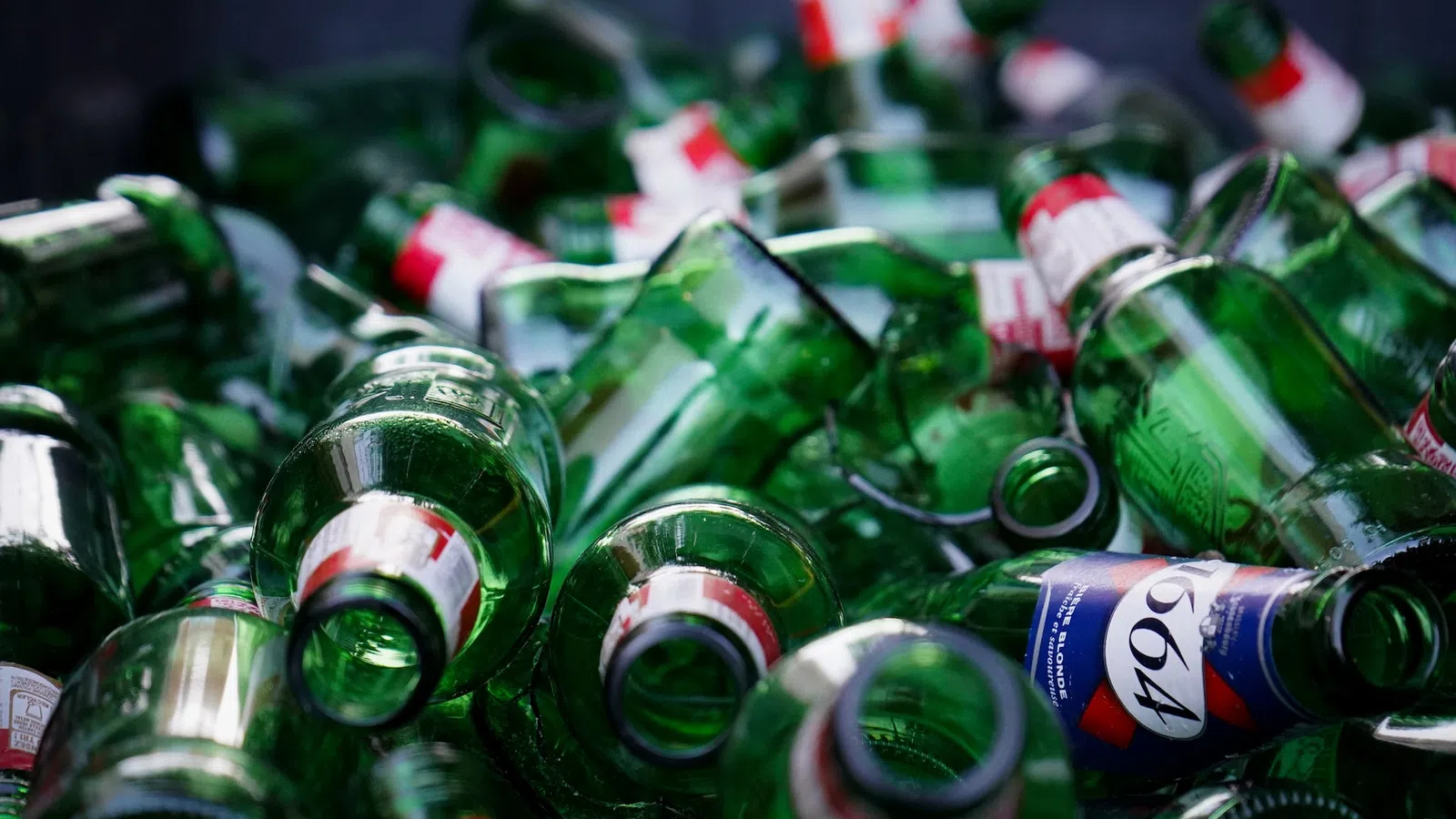 a pile of green bottles