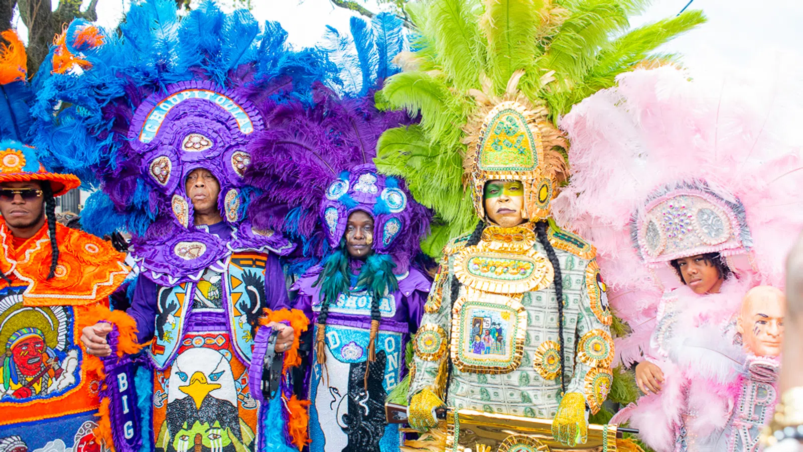 Super Sunday with the local Mardi Gras Indians vibrant costumes showcasing intricate, hand-sewn suits, drumming, and chanting, primarily taking place Uptown at A.L. Davis Park (LaSalle St & Washington Ave) starting at 12 p.m on Sunday March 15, 2026 . in the photo is Flag boy giz posing with Mardi Gras Indians.
